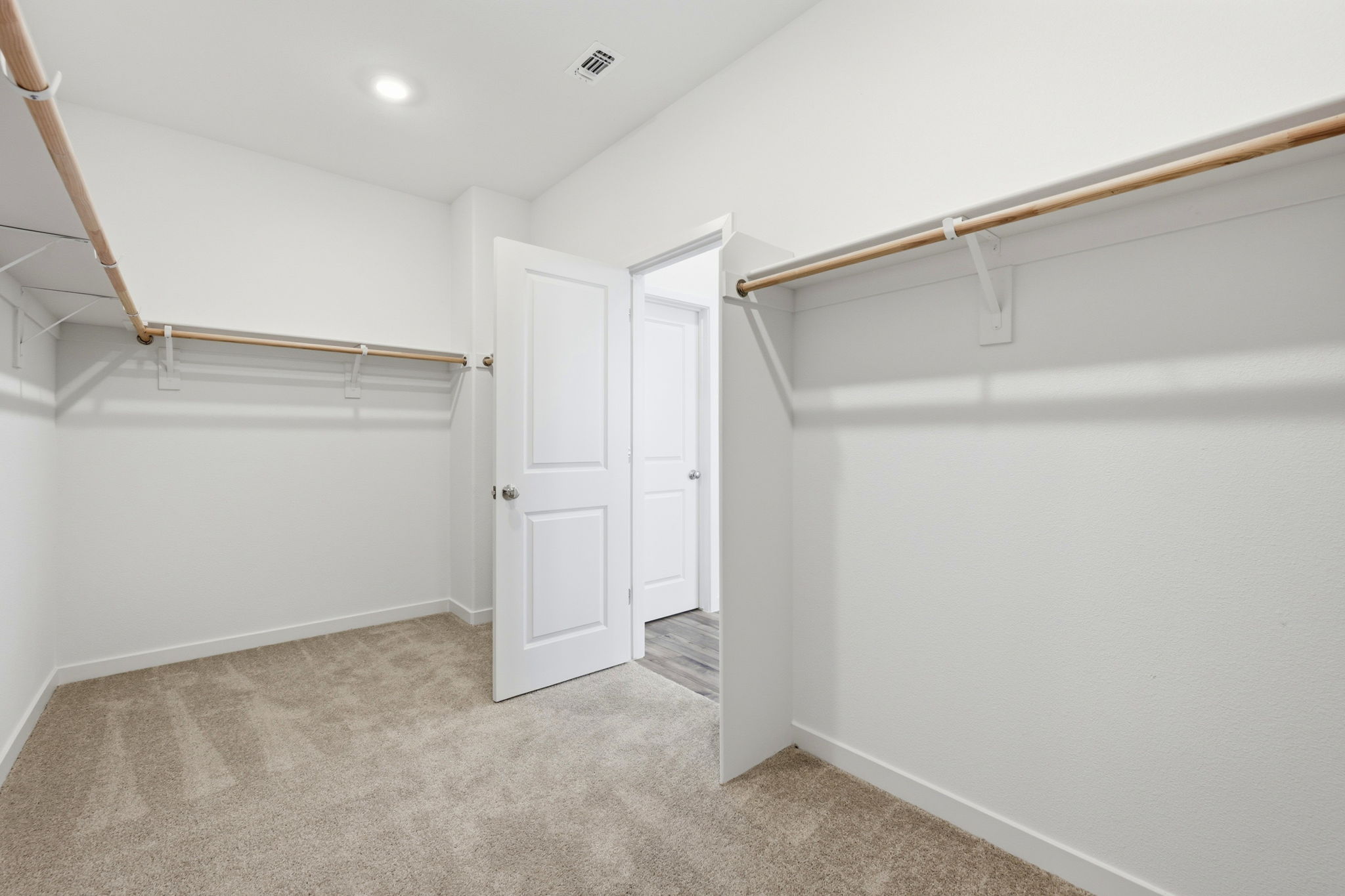 A room with white walls and a staircase.