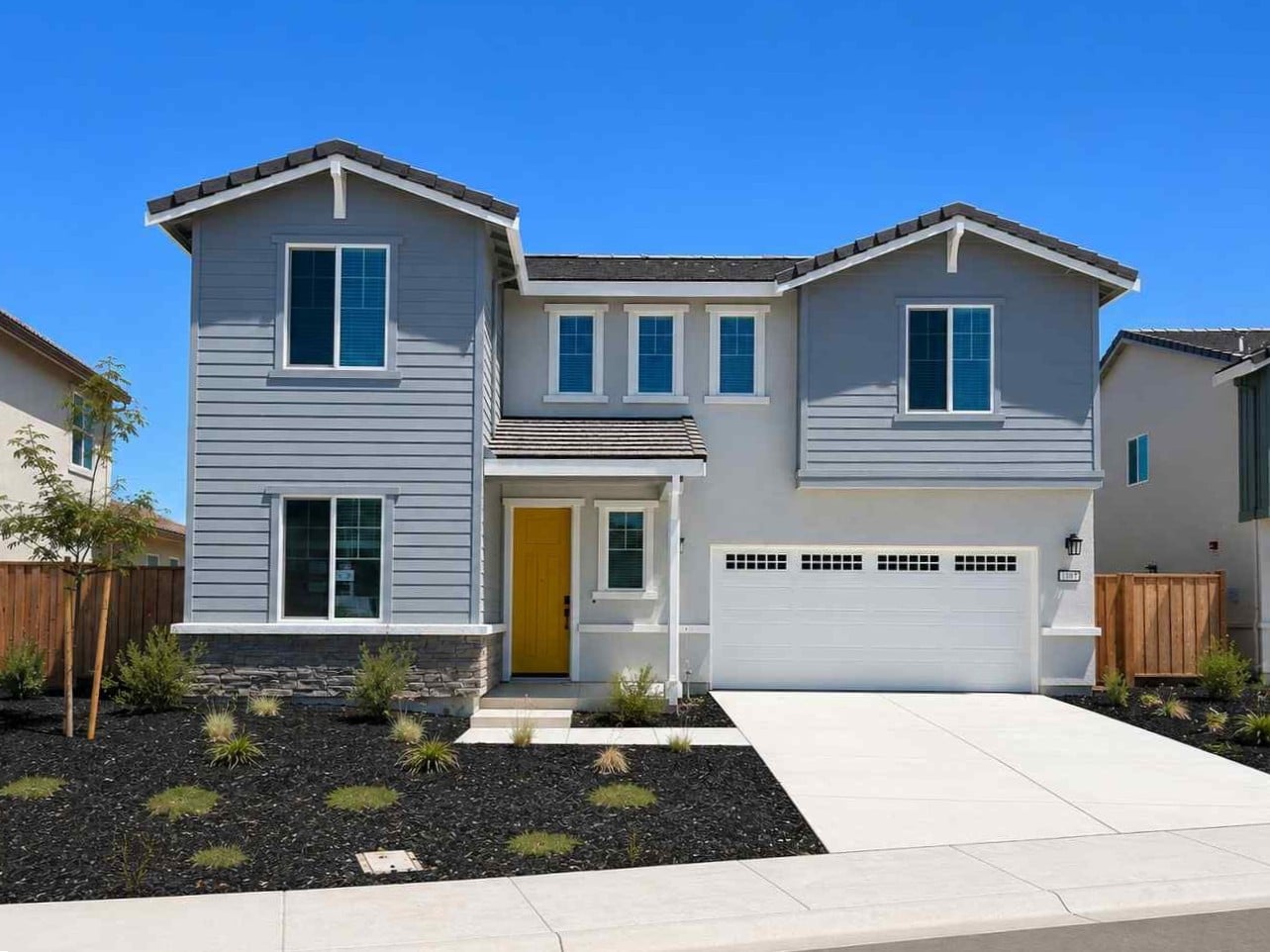 A white house with a driveway.