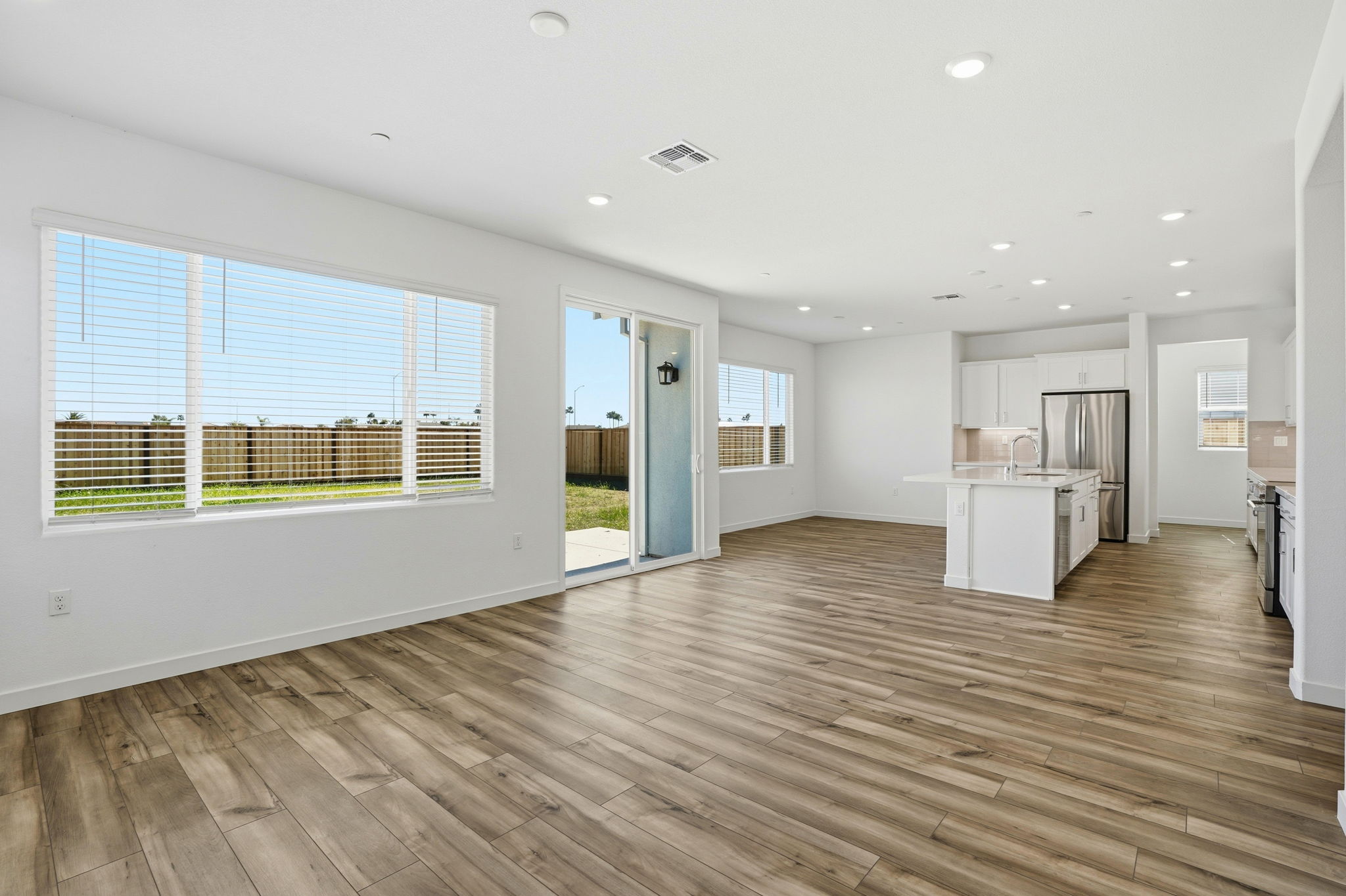 A large room with a wood floor and a wood floor.
