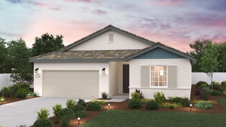 A house with a driveway with American Gothic House in the background.