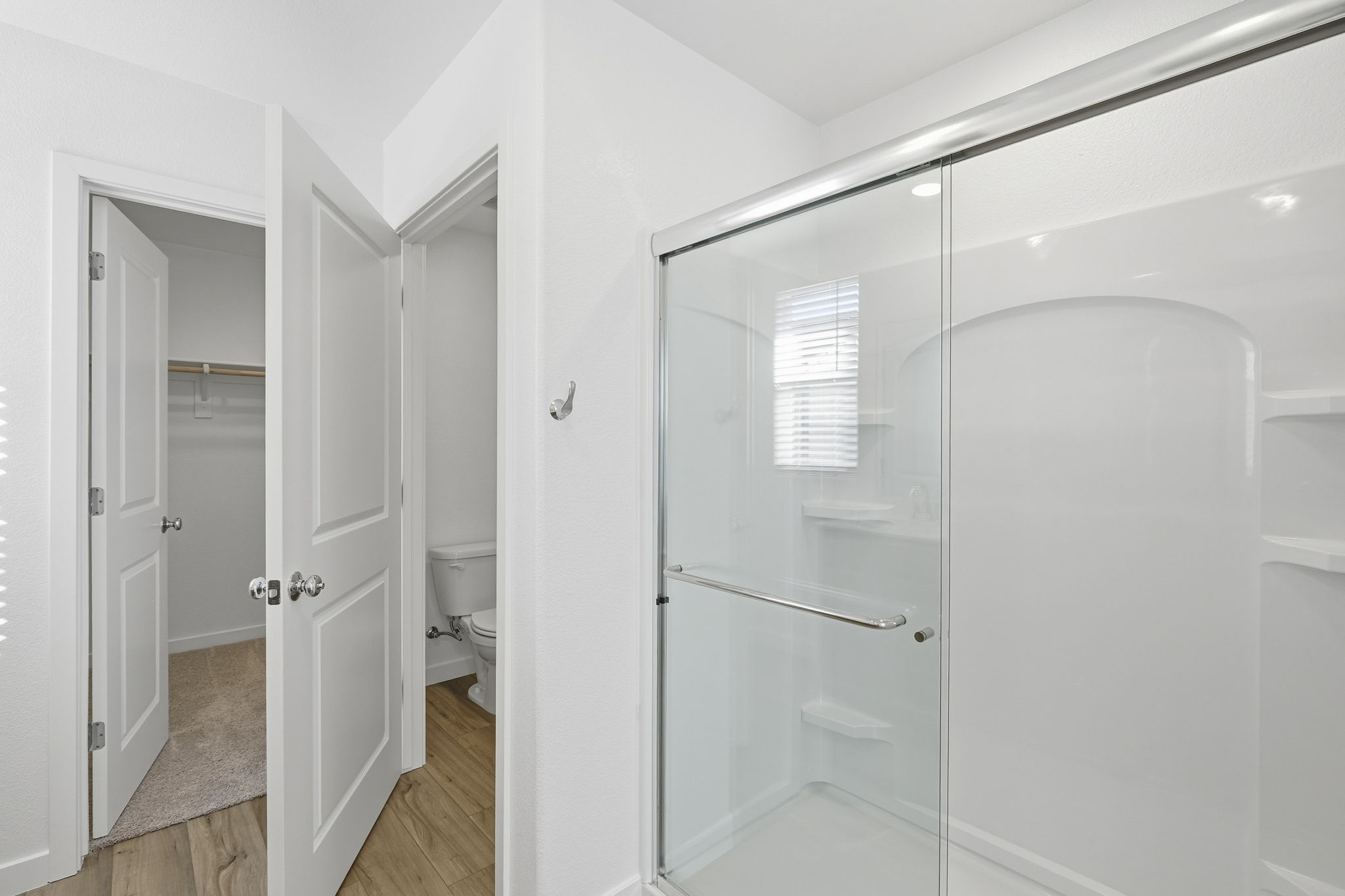 A bathroom with a glass shower.