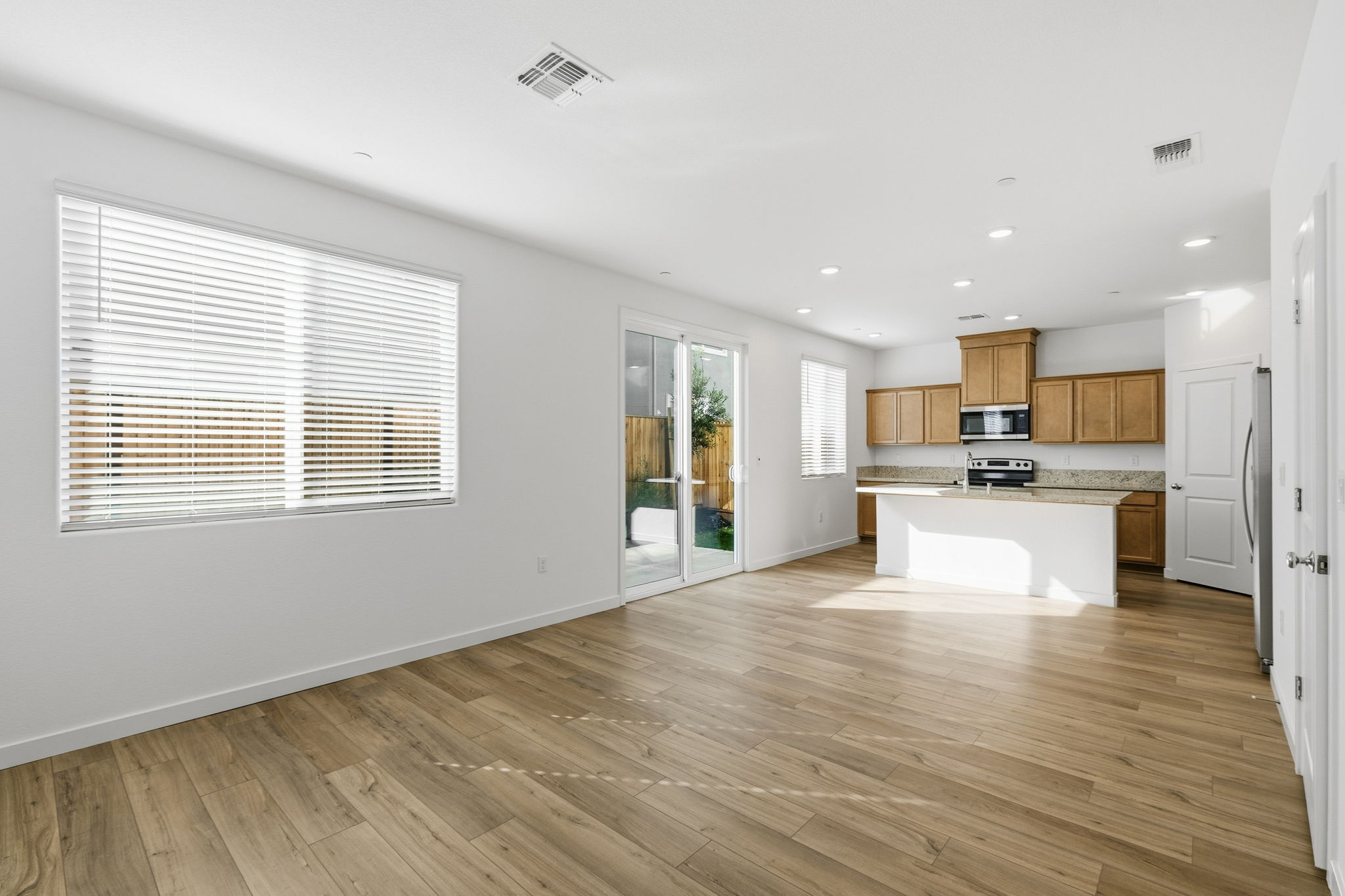 A kitchen with wooden floors.