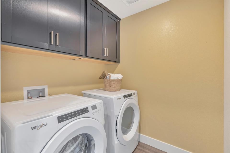 A laundry room with a dryer and dryer.