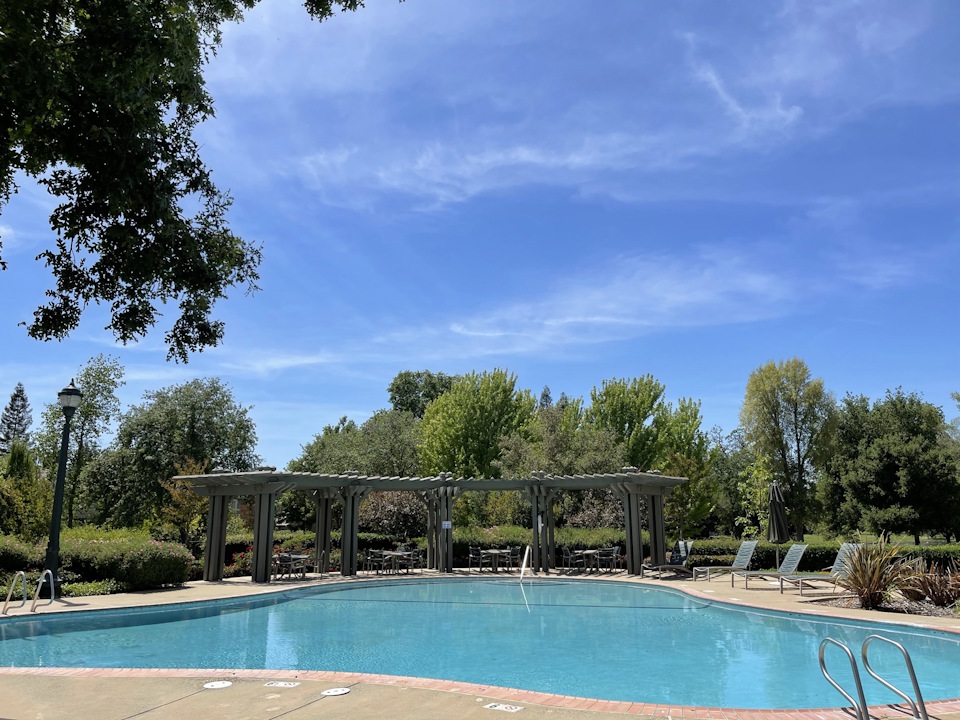 A swimming pool with a covered area.