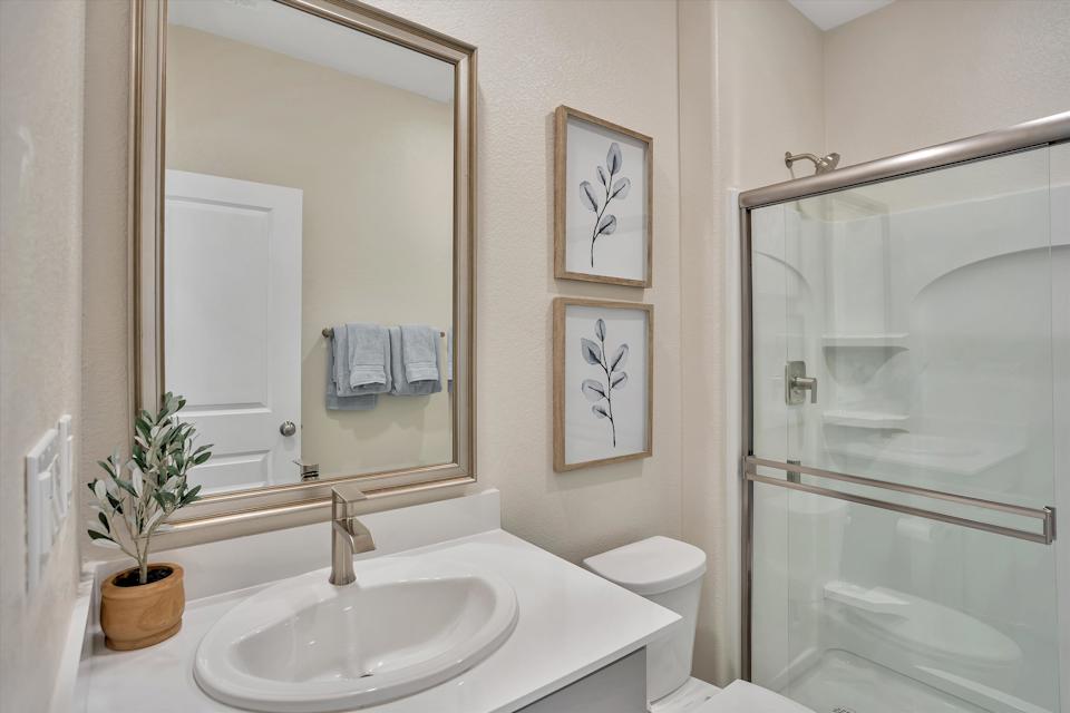A bathroom with a glass shower.