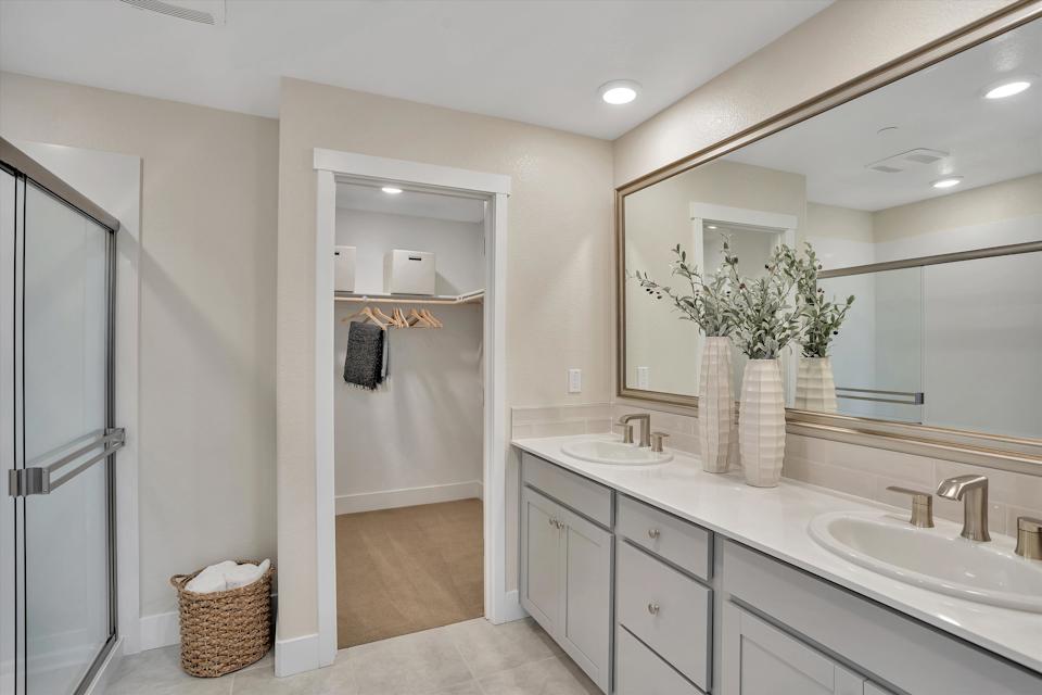 A bathroom with a shower and sink.