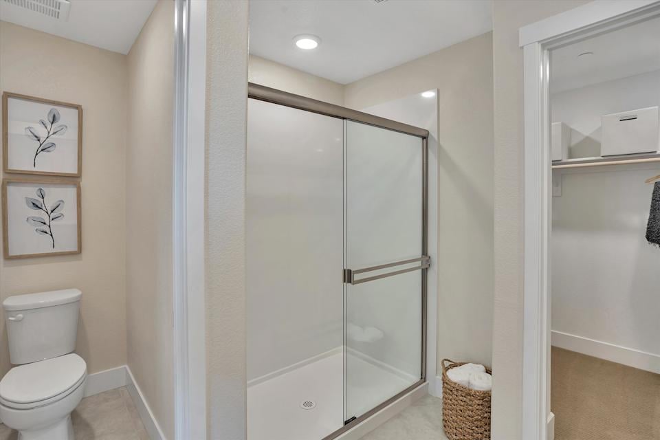 A bathroom with a glass shower.