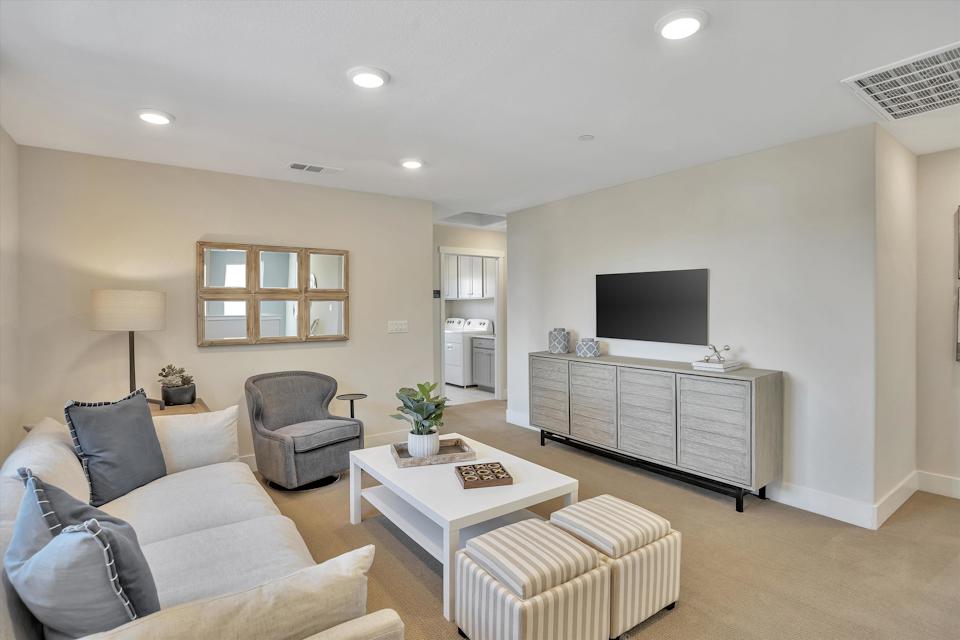 A living room with a tv and couches.