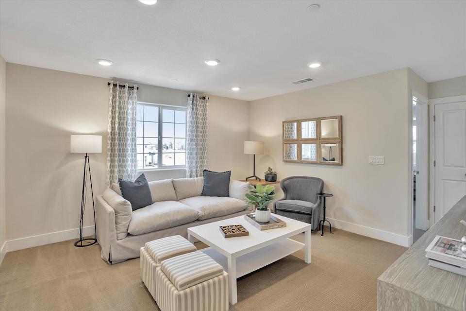A living room with a couch and a coffee table.