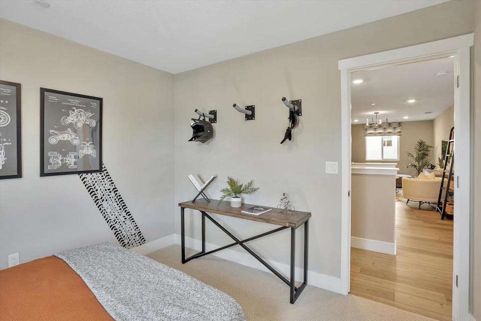 A room with a bed and a table.