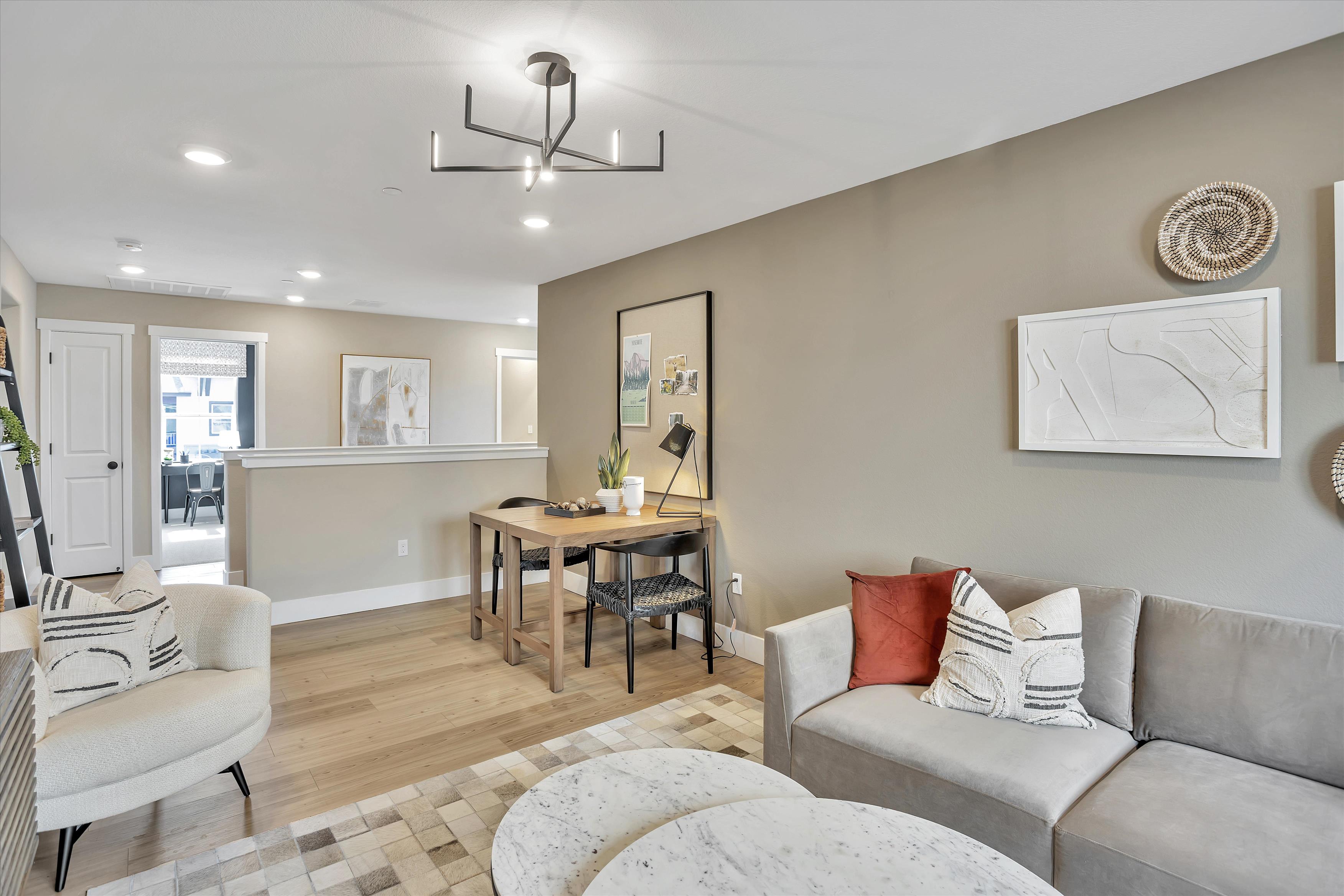 A living room with a couch and a table.