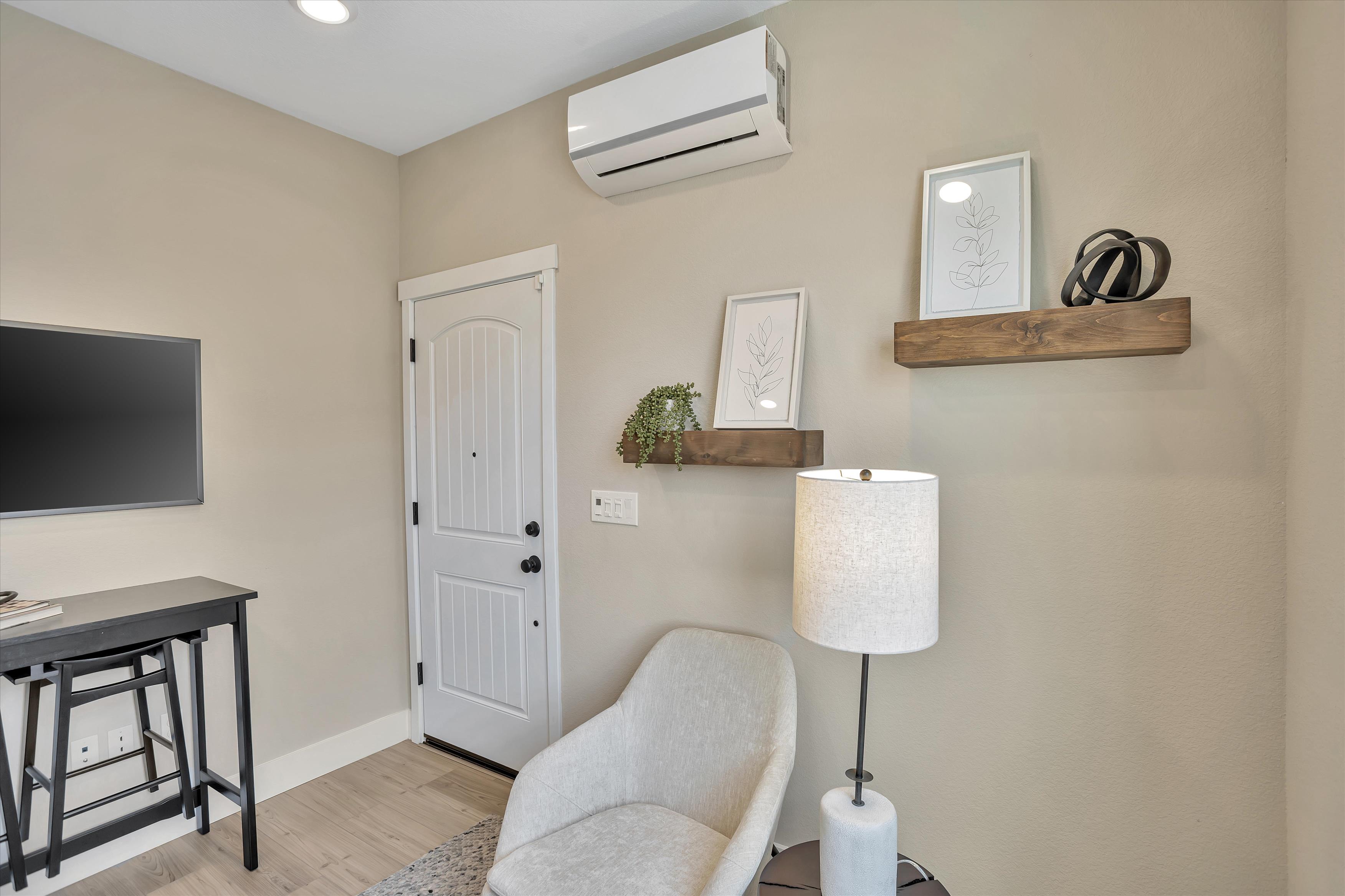 A room with a desk and a chair.