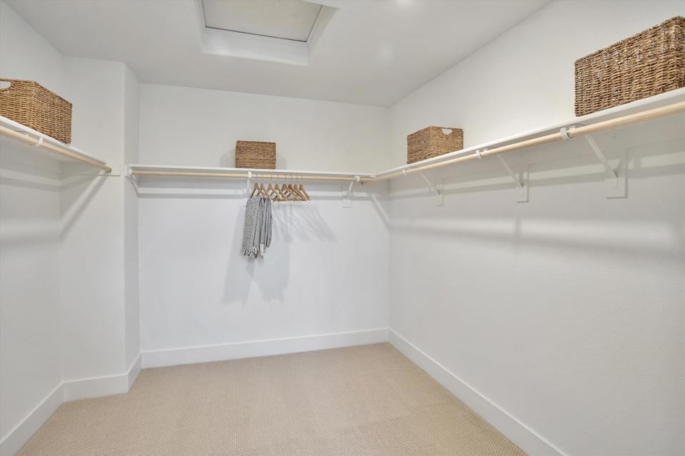 A white room with a white wall and a basket with a basket on it.