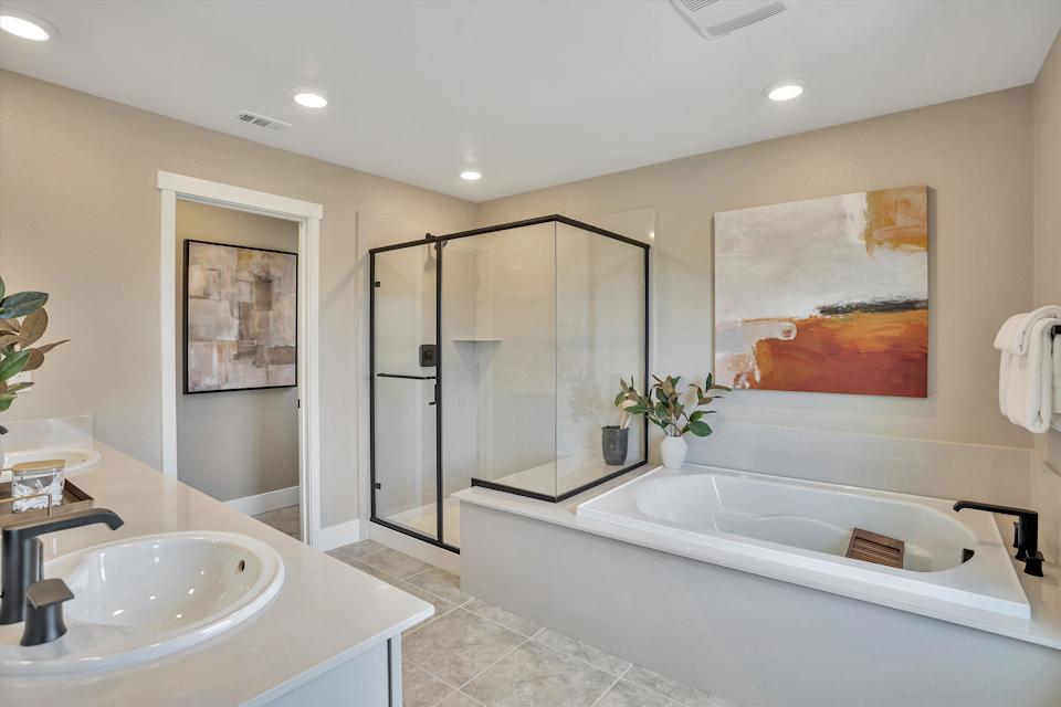A bathroom with a large glass shower.