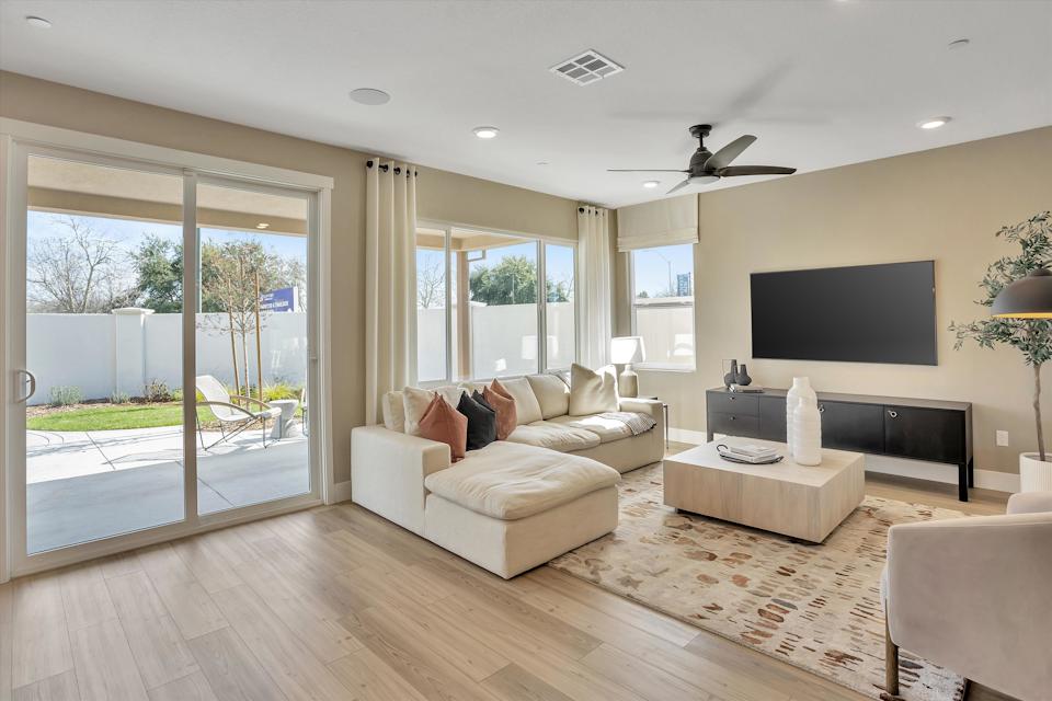 A living room with a large glass door.