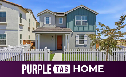A house with a white picket fence.