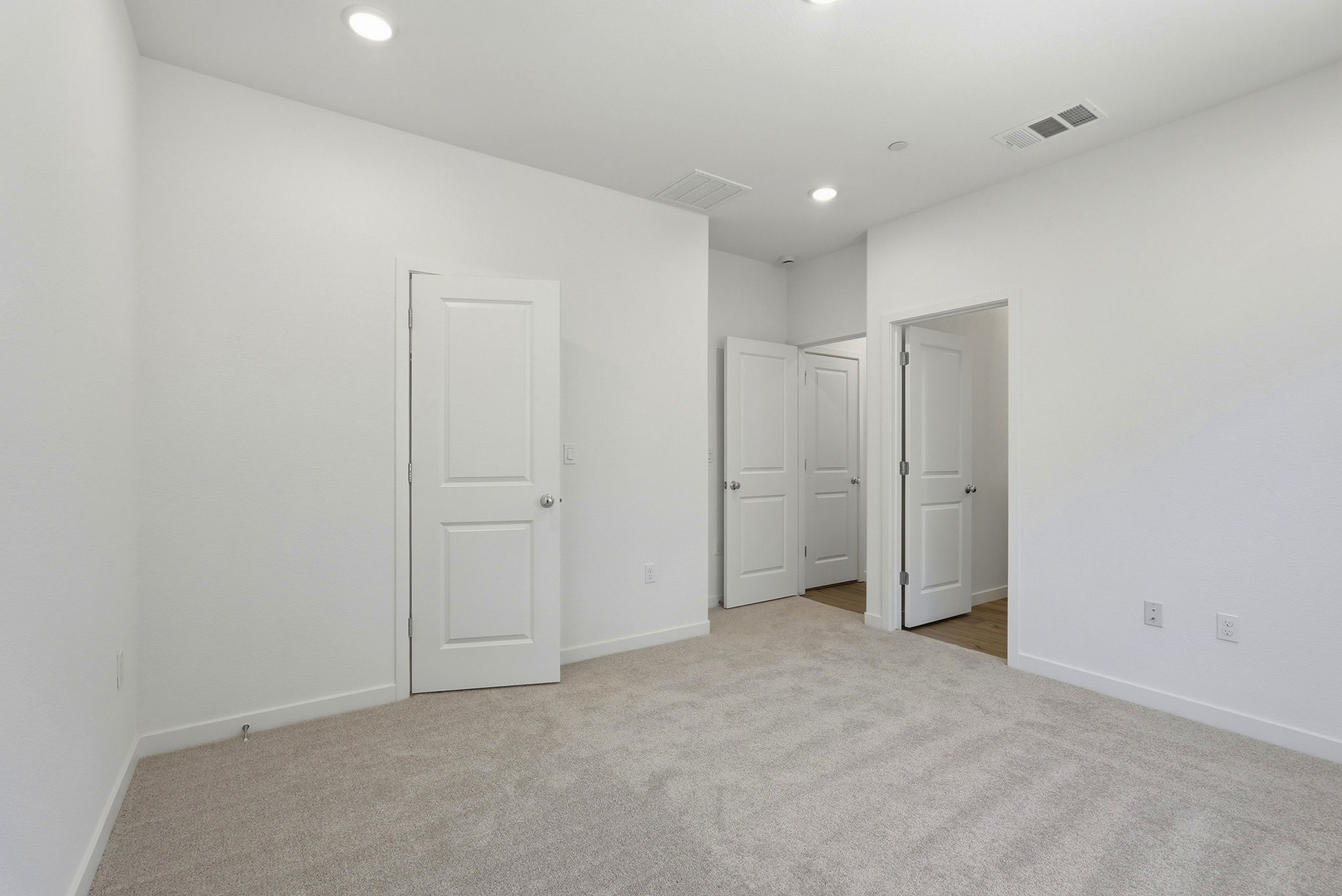 A room with white doors.