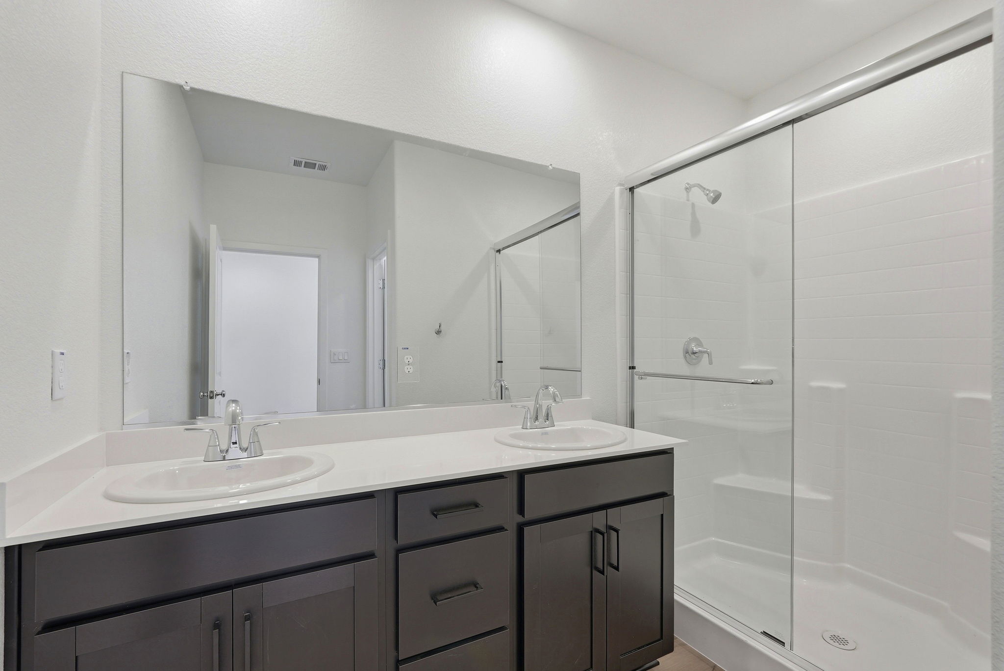 A bathroom with a glass shower.