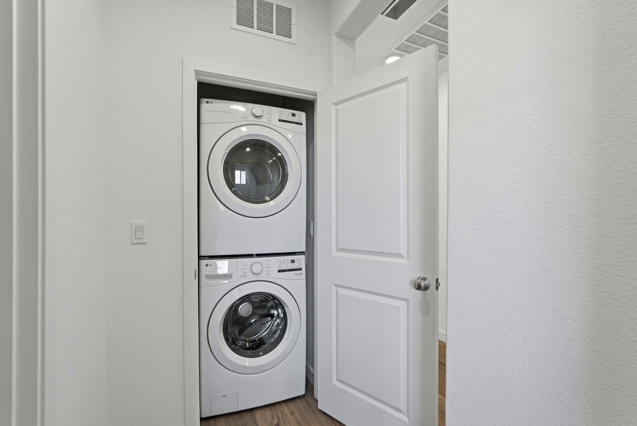 A washing machine in a room.