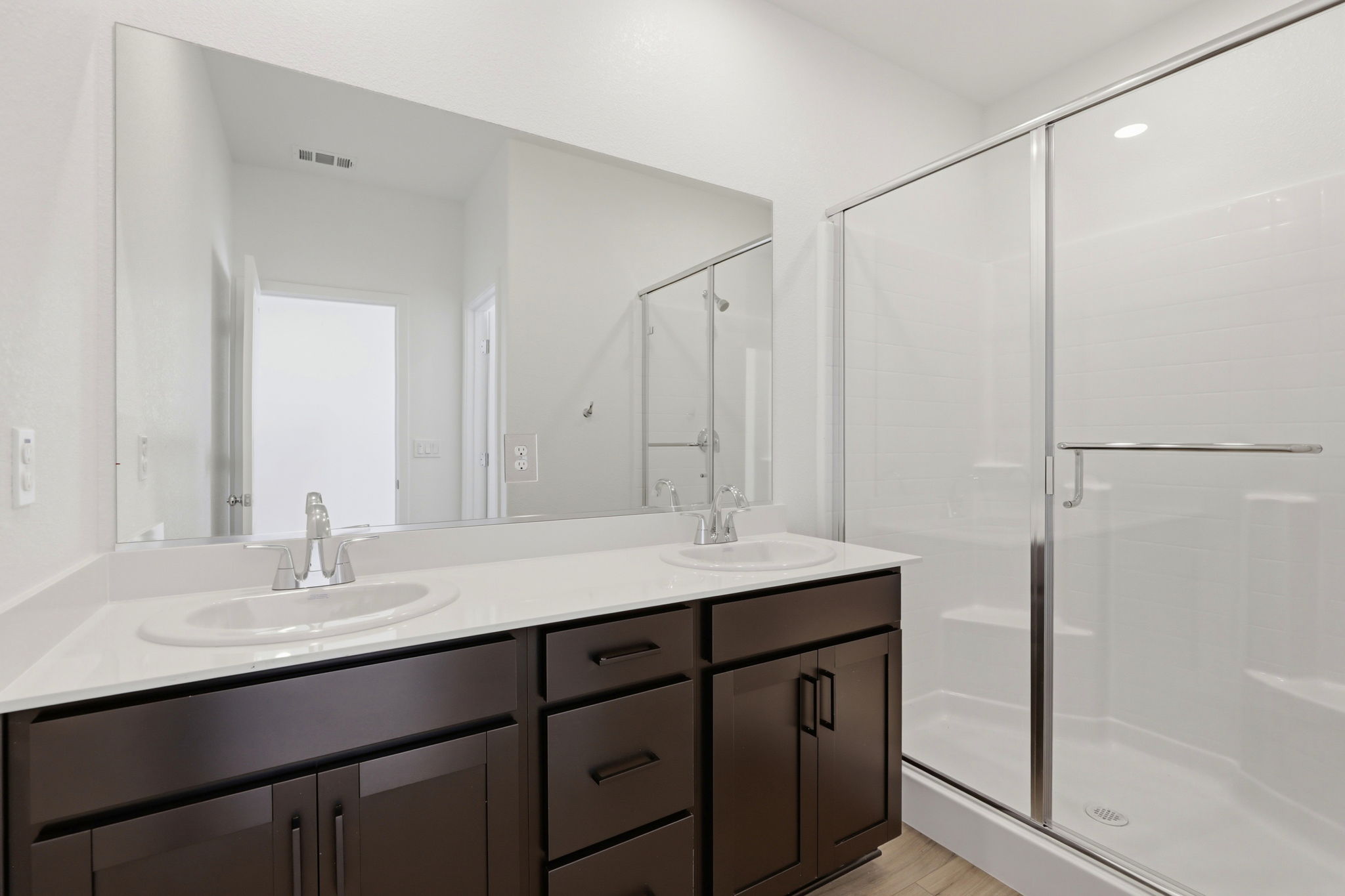 A bathroom with a glass shower.