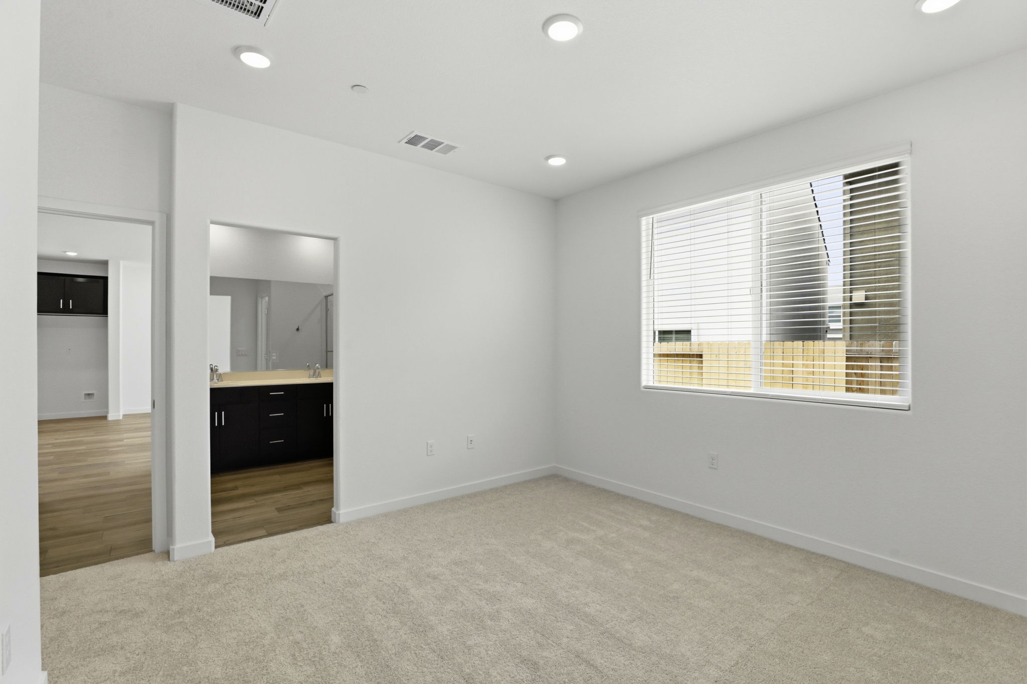 A room with a window and a sink.