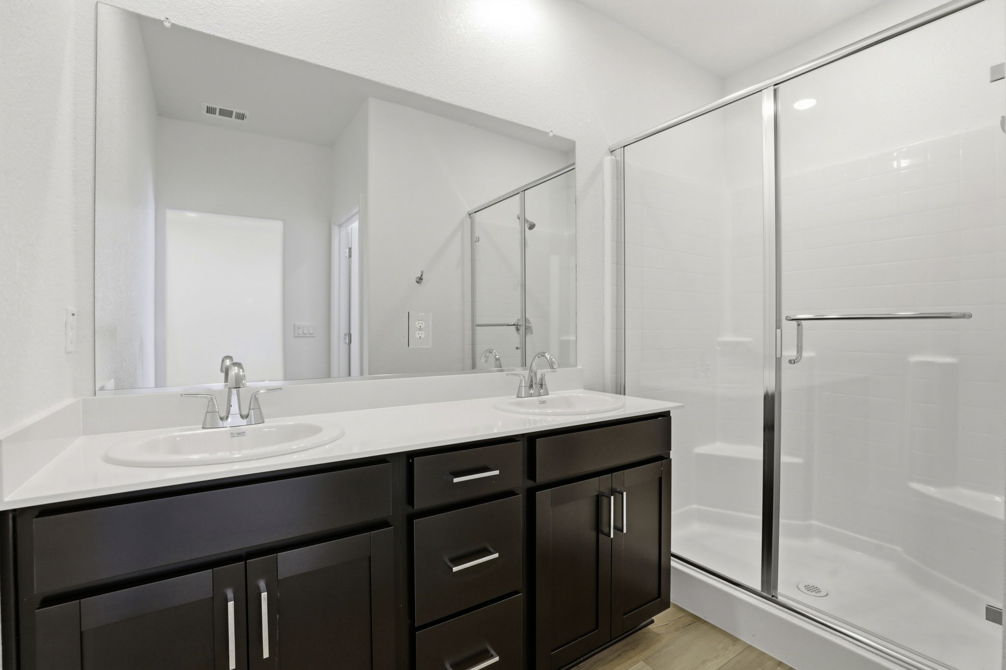 A bathroom with a glass shower.