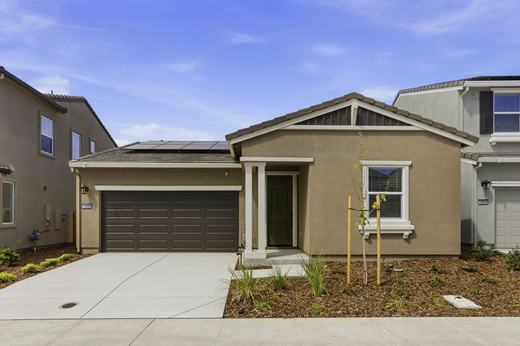 A house with garages and a driveway.