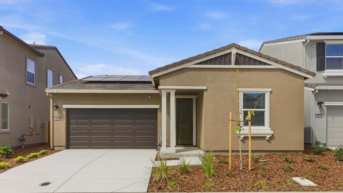 A house with garages and a driveway.