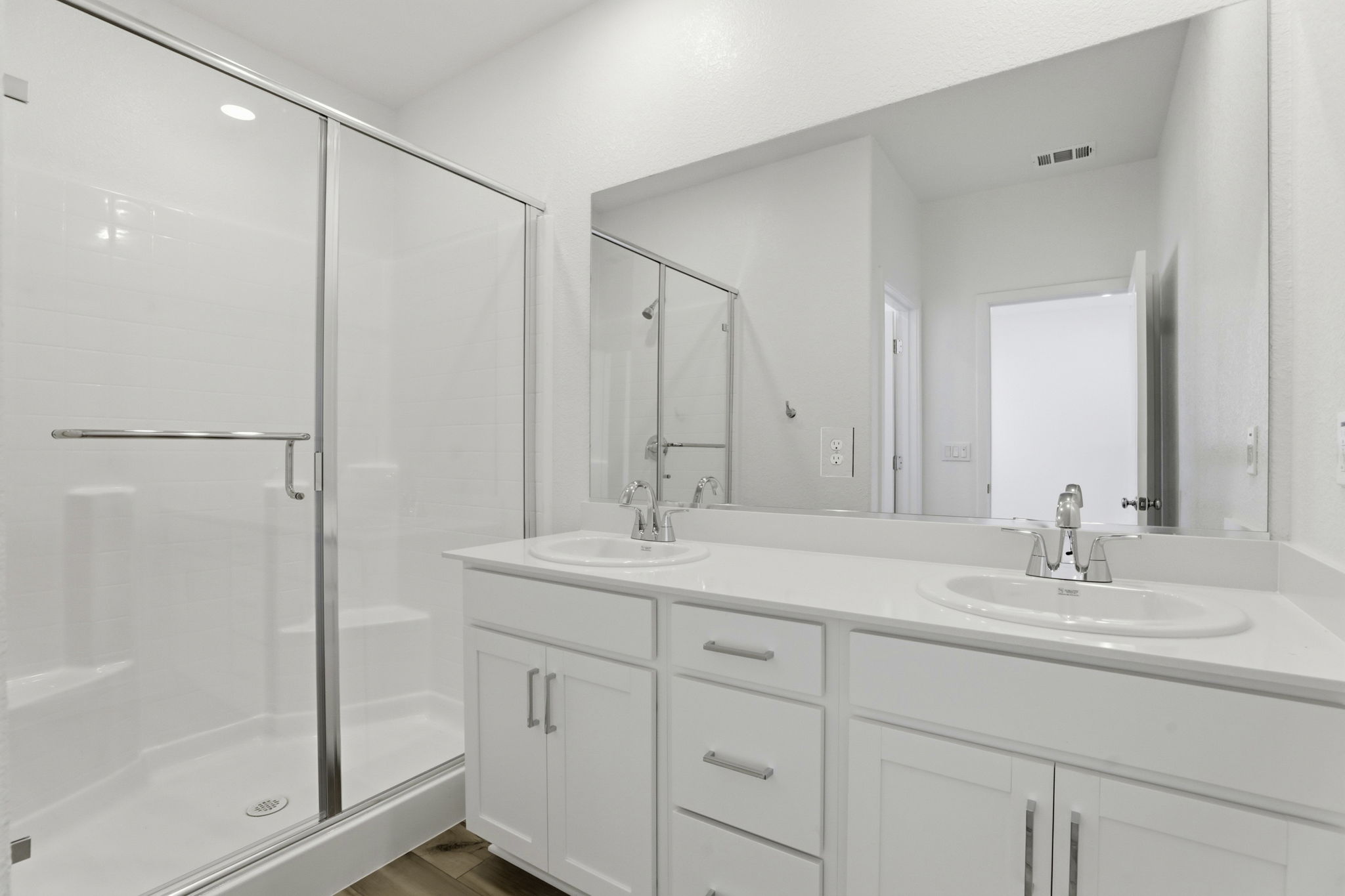 A bathroom with a glass shower.