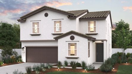 A white house with a garage.