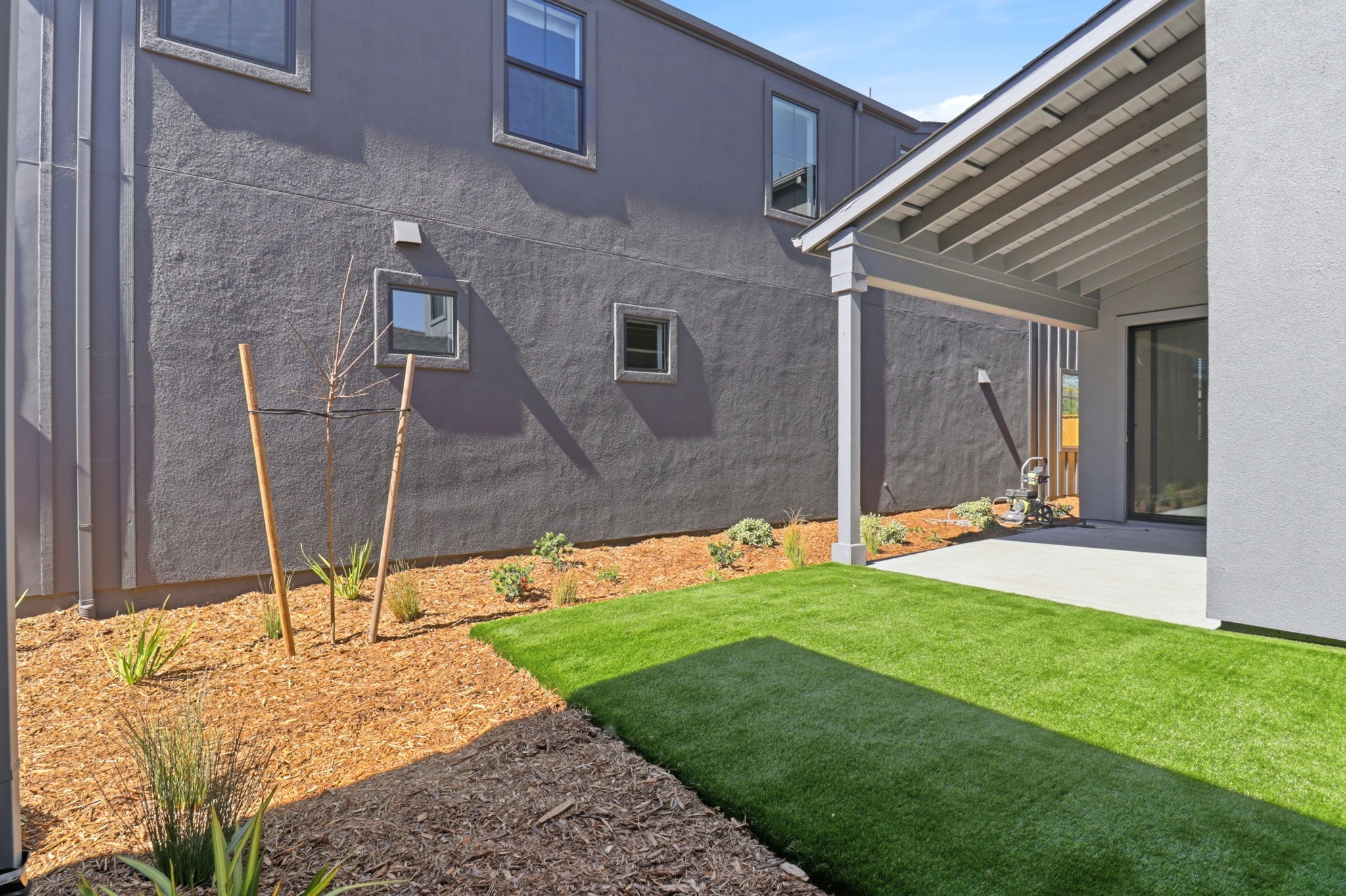 A backyard with a small pool.