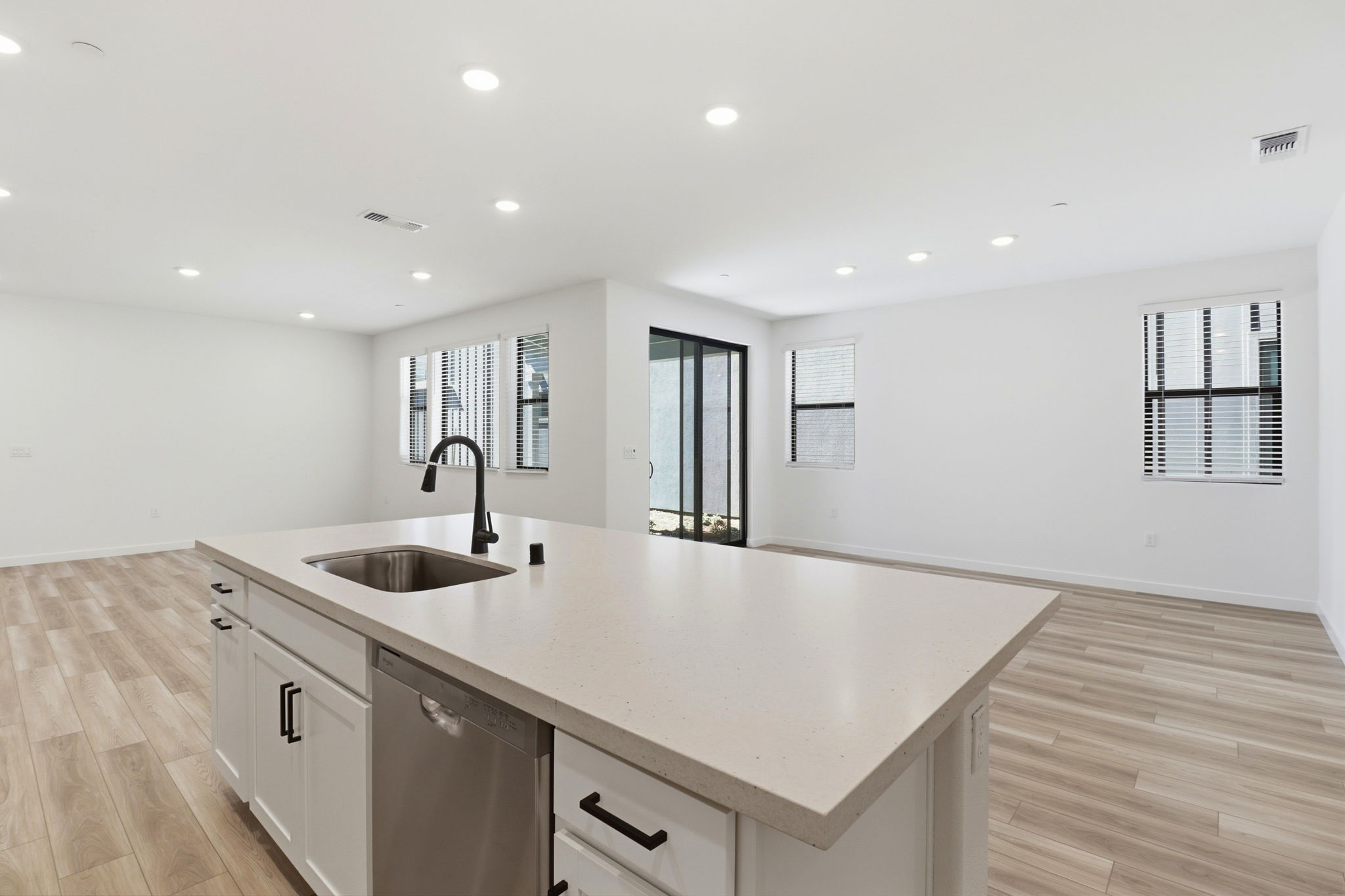 A kitchen with a sink and cabinets.