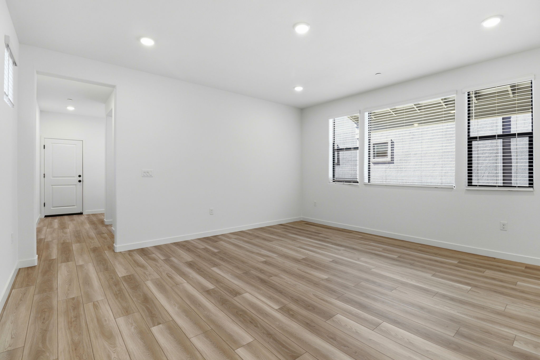 A room with a wood floor and a wood floor.