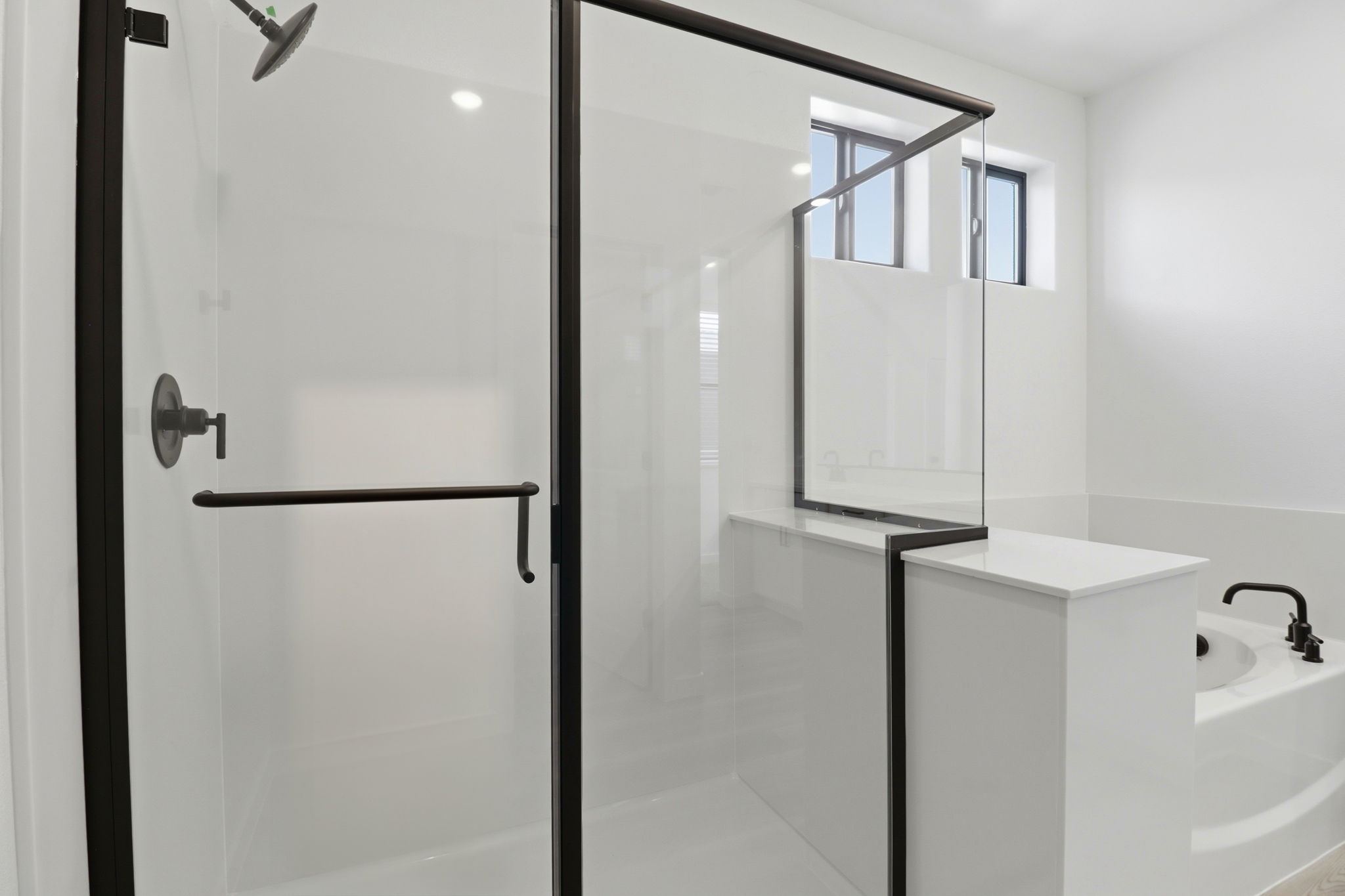 A bathroom with a glass shower.