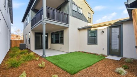 A house with a green lawn.