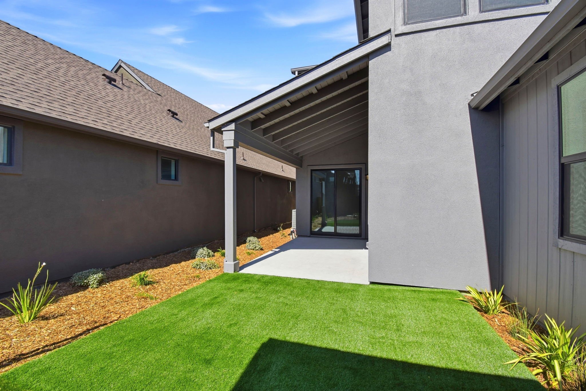 A house with a green lawn.