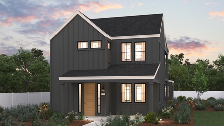 A house with a fence and trees in the back.