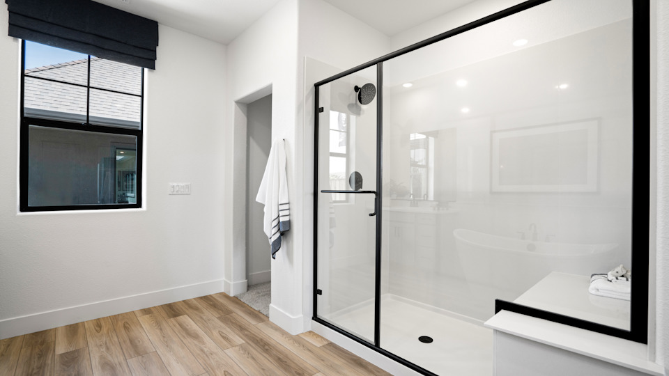A bathroom with a glass shower.