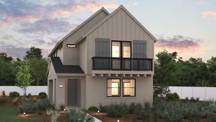 A house with a fence and trees in the back.
