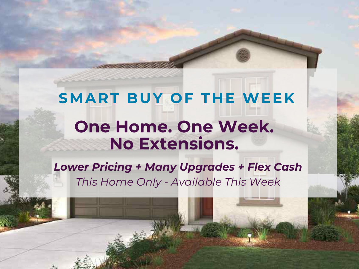 A white house with a sign in front of it.