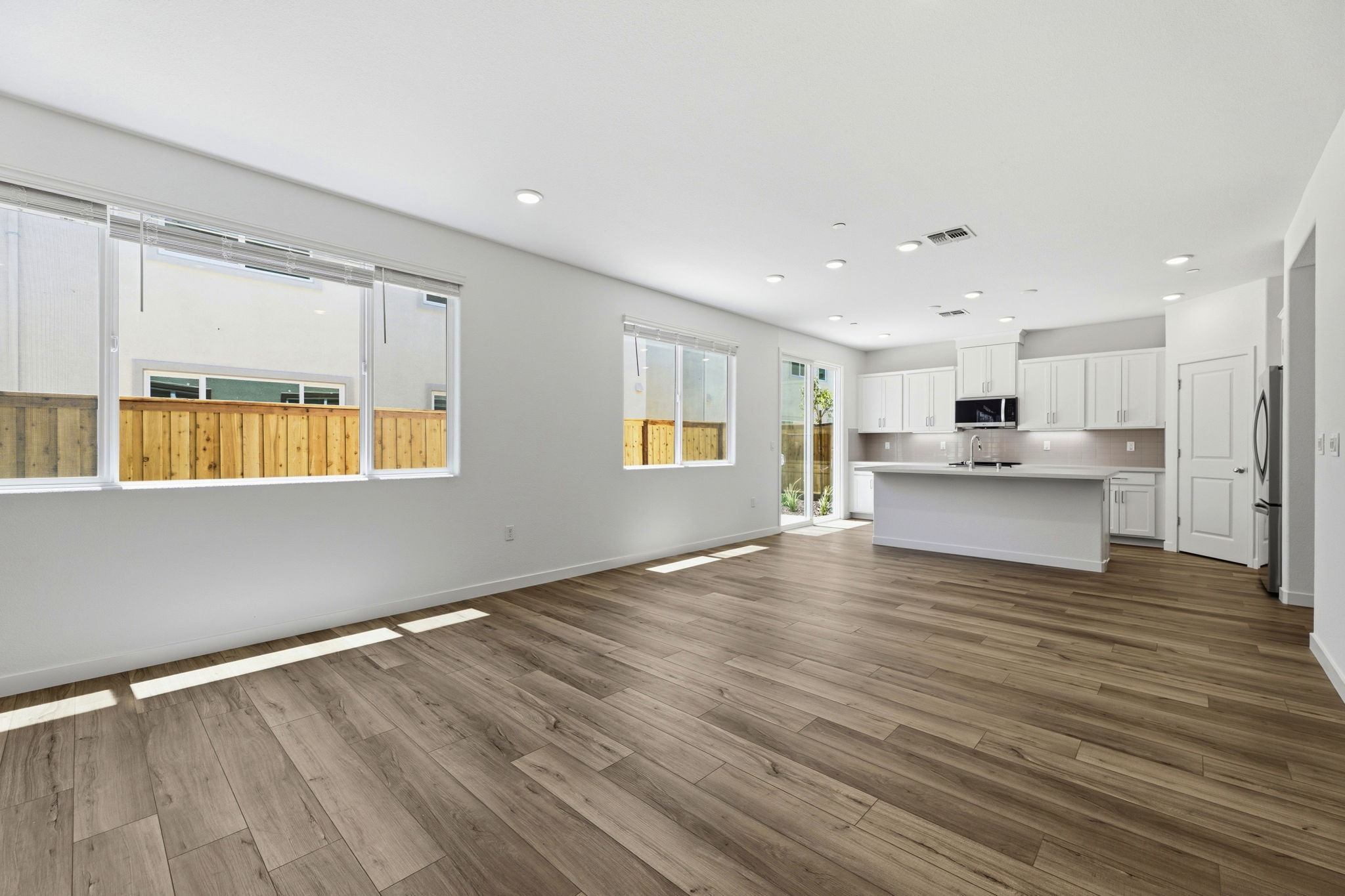 A large kitchen with white cabinets.