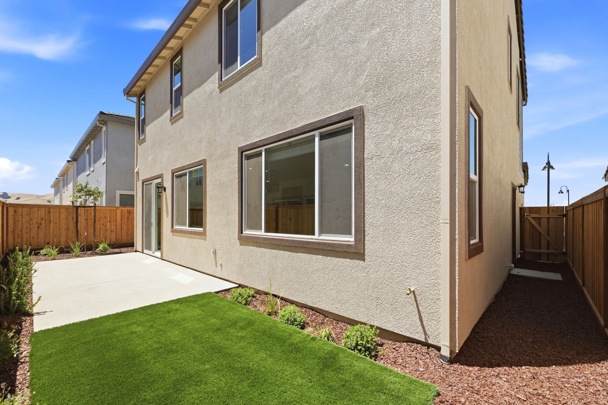 A house with a grass yard.