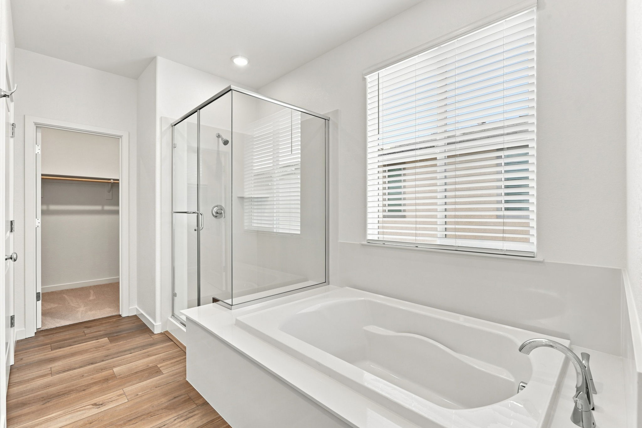 A bathroom with a tub and shower.