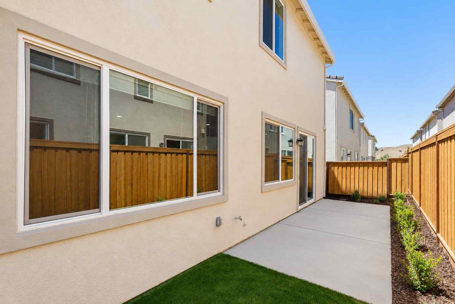 A house with a fence and a yard.