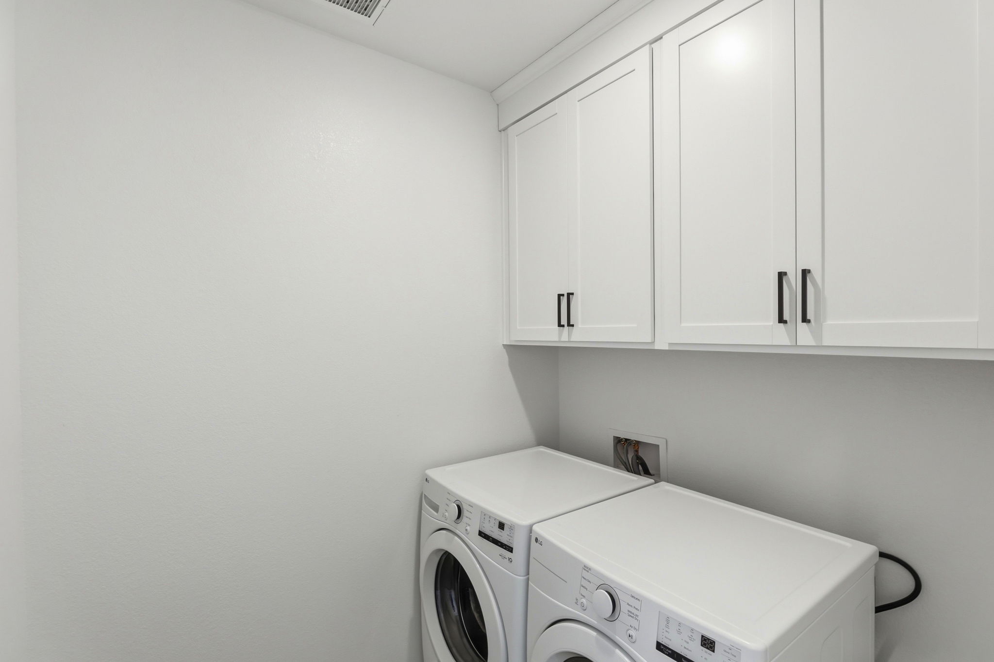 A white room with white cabinets.