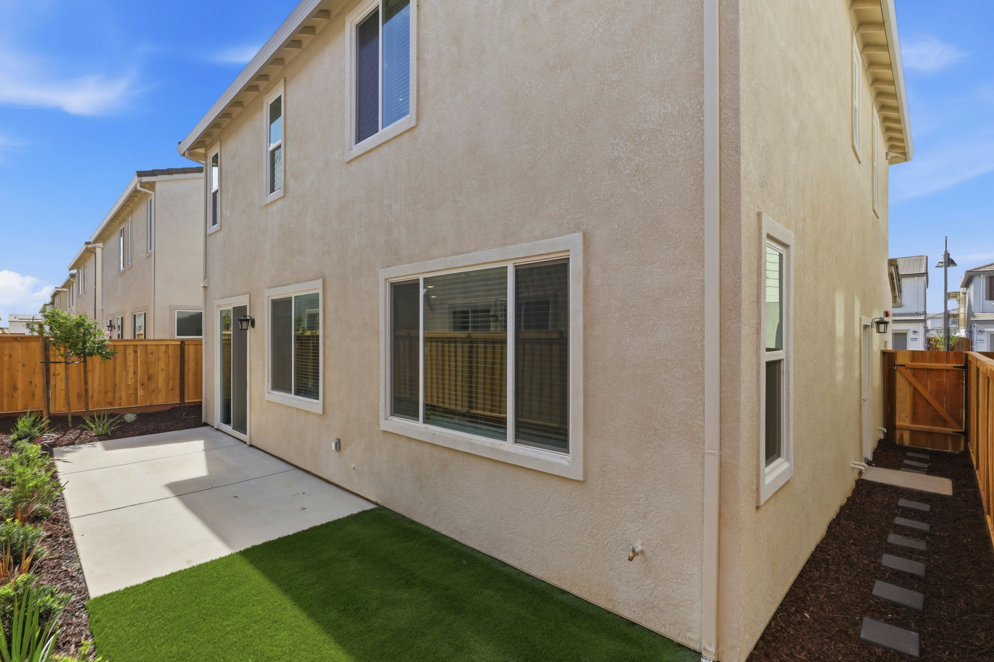A house with a fence and a yard.