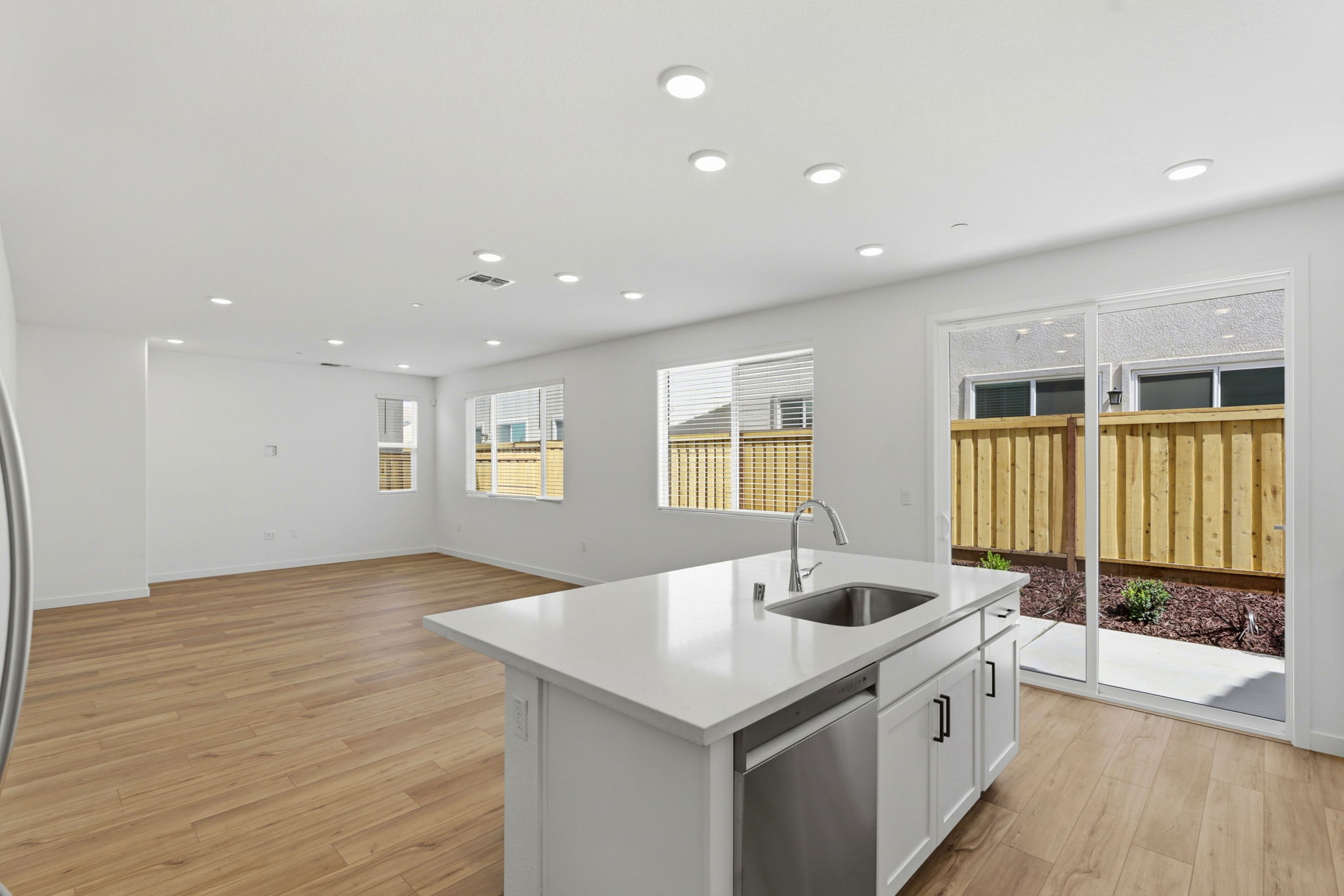 A kitchen with a sink and a window.