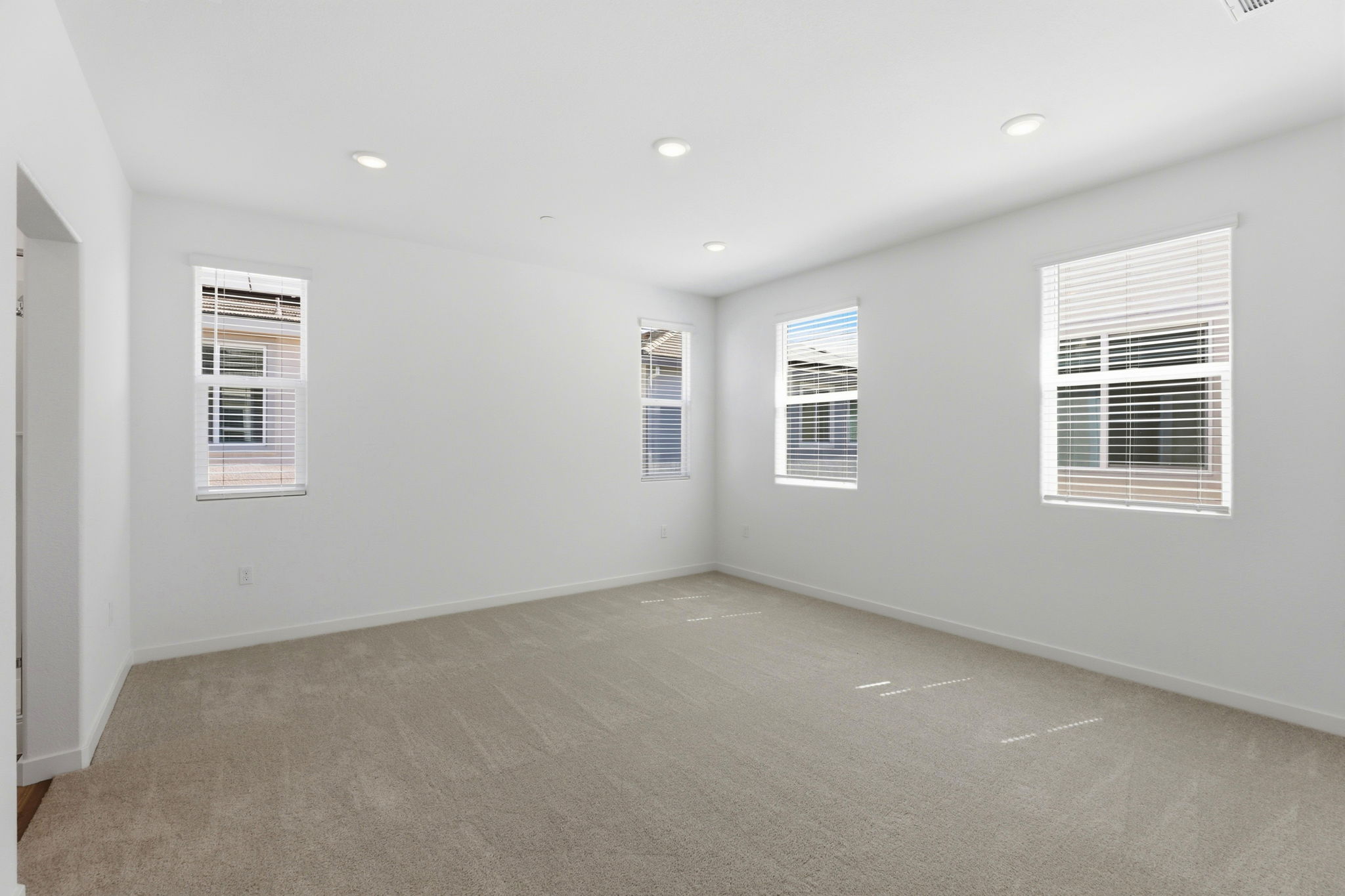 A room with white walls and windows.