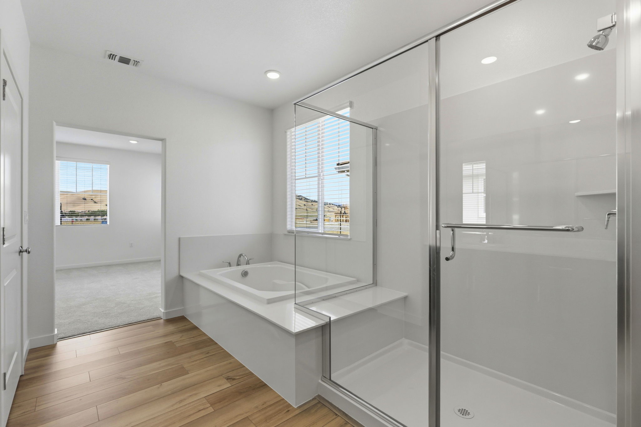 A bathroom with a tub and sink.