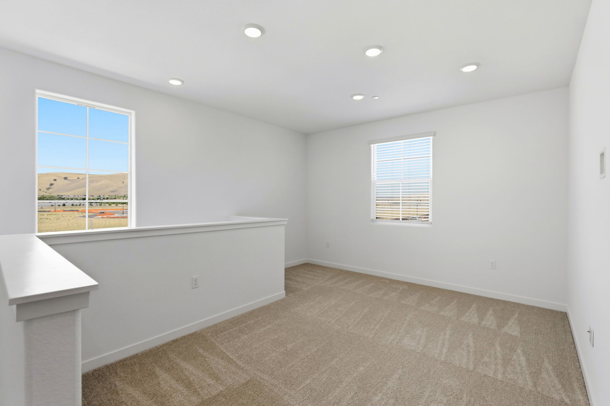 A room with a window and a counter with a window.